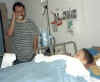 Kalib in hospital, dad on phone 11.99.jpg (9546 bytes)